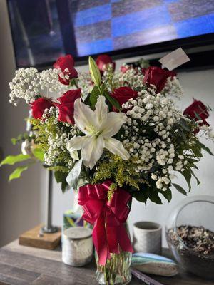 A dozen red roses , my living room smells so nice