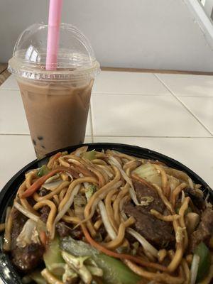 Beef lo mein and mango milk tea with bubbles