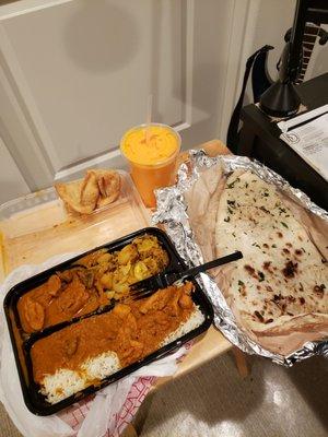 chicken curry, veggies, samosas, garlic naan and mango lassi