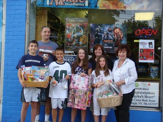 Legislator Norma Gonsalves visits The Comic Book Depot to help spread the word for Kaylee's Heart