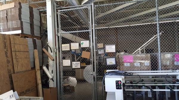 Behind Gates: Conveyor System where the employee dumps your paper docs to shred