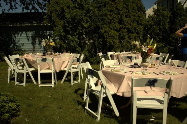 My backyard bridal shower. Tables, chairs, tablecloths, and glasses provided by Ace Party Rental.