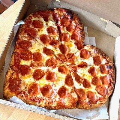 Heart shaped pizza on Valentine's Day