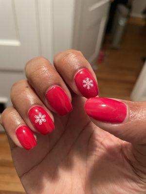 Gel manicure with snowflake stickers