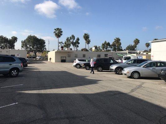 Plenty of parking in the back lot, no need to double park at the red fire zone lanes near the front area