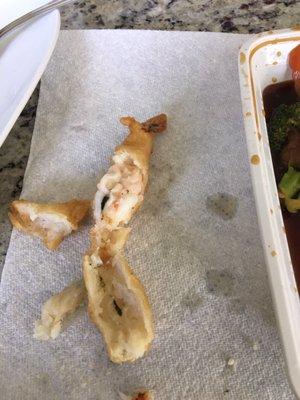 Unclean shrimp and undercooked batter.