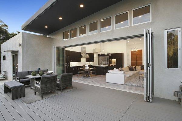 Gorgeous open concept deck with sliding windows that open all the way for easy entertaining.