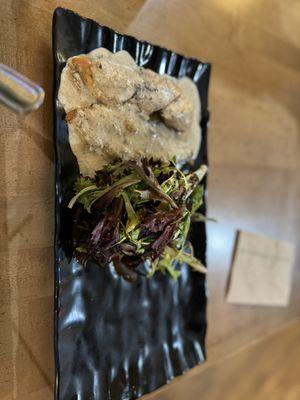 Fire-Grilled Chicken Entree with mushroom cream and a salad.