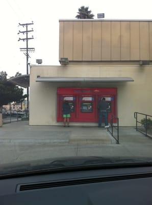 the ATMs have a simple shade (no enclosure, or privacy partitions)