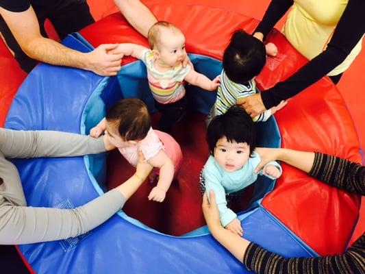 Babies get lots of social interaction and strengthening in a colorful and stimulating environment