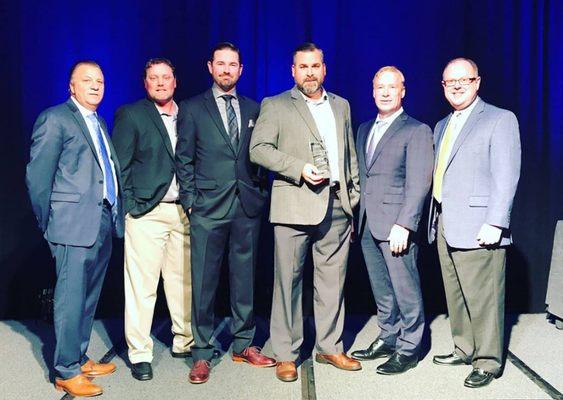 Tugwell Roofing Estimating Team - Jeff, Dan & Chris receiving our prestigious GAF President's Club Award from the GAF President.