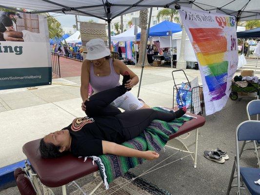 Monica providing hip stretch and ankle mobilization for better flexibility.