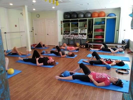 Mat class at Pilates Tutor in Marietta builds a strong core, relieves back pain and increases flexibility