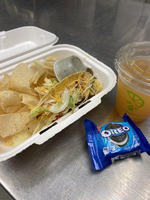 Kids meal - taco, chips, guacamole, mango tea, and dessert (Oreo cookie)