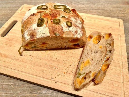 Jalapeño Cheddar Sourdough Loaf. Spicy and fresh with globs of cheese found throughout the bread.