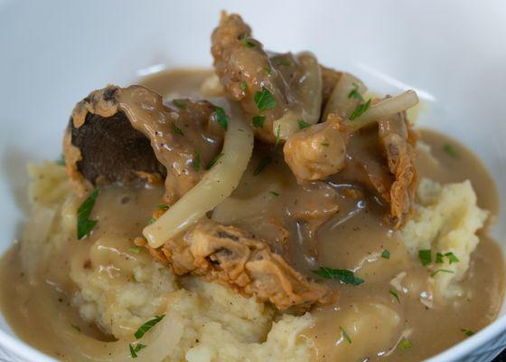 Smothered fried mushrooms in a gravy sauce