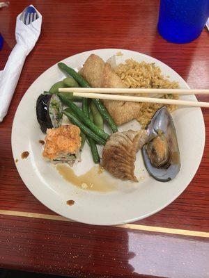 Sushi, edamame, green beans, egg roll, fried rice, mussel, fried dumpling