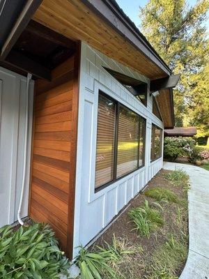 New siding, soffits and paint. James hardie board and batten. Clear cedar accent wall. Tight knott grade soffits