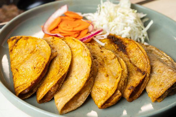 Soft, flavorful tacos filled with savory fillings like chicharrón and potatoes simple, delicious, and a must-try!"