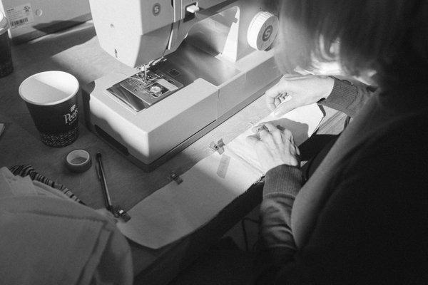 Student preparing a collar to be sewn at a sewing workshop.