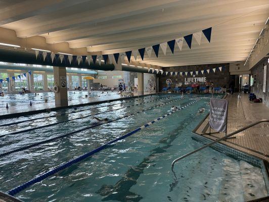 The swim team takes over the entire indoor swim area... both pools