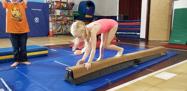 Bear crawl on balance beam