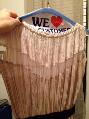 The pleated dress after dry cleaning - completely ruined