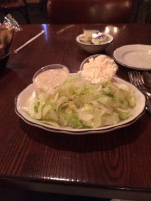 Tossed salad that comes w your meal. Very large and I ordered it plain w only feta cheese. It normally comes w more items.