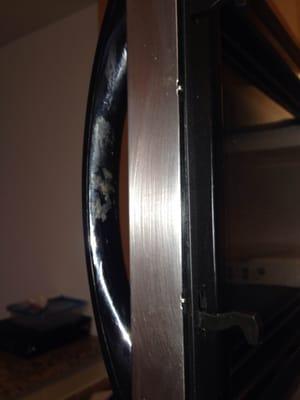 Grime on the microwave door handle not removed.