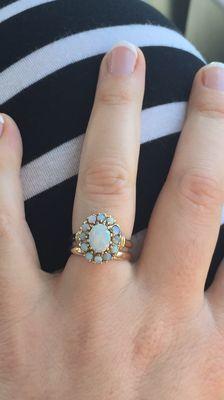 Opal engagement ring with gold wedding band made to fit underneath large stone.