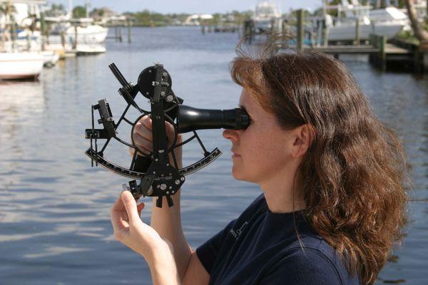 A Chapman student learns how to use a sextant.