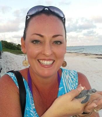 Sarah Kline President of Time For Travel LTD Happy to release baby turtles in Mexico