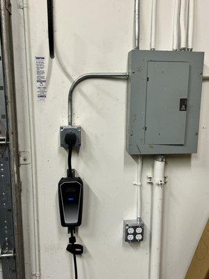 Commercial business EV charger installation. This is a wall plug configuration.