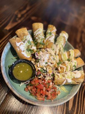 Taquitos with pico, crema and street corn! Amazing