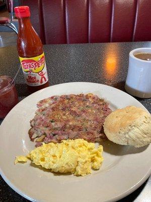 Corn beef hash, Scrambled eggs , and a biscuit.