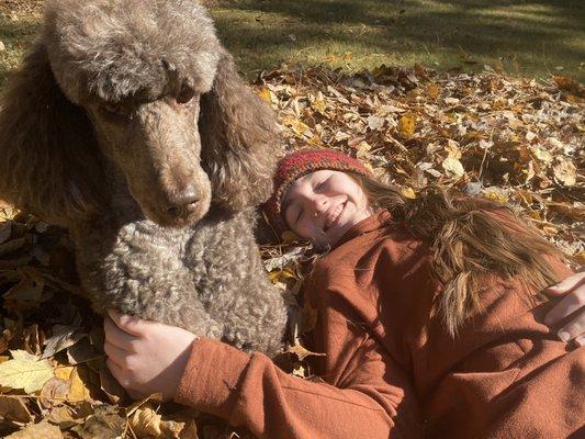 Coco and Madeline after jumping on a pile of leaves Fall 2021.