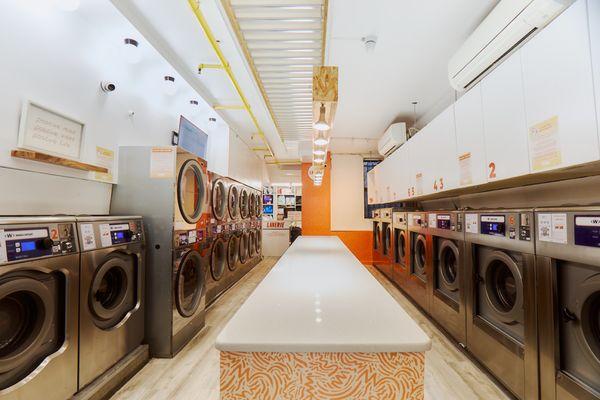 Step into Laverie and experience a clean, modern, and efficient laundromat!