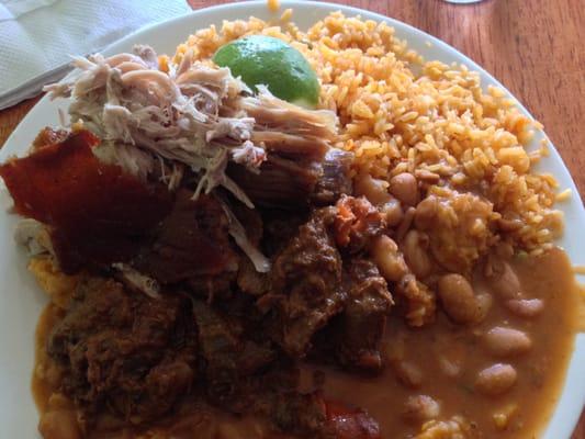 HUGE lunch plate of rice/beans, stewed beef, and crispy pork.