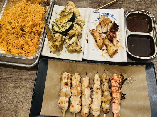 Kimchee fried rice, grilled zucchini & cauliflower, squid. Skewers of chicken, chicken skin, & shrimp.