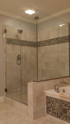 Frameless shower enclosure using the U-Channel System in Brushed Nickel finish D2P kneewall.