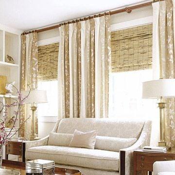 Beachy Woven Woods paired with drapes is a big trend this year.