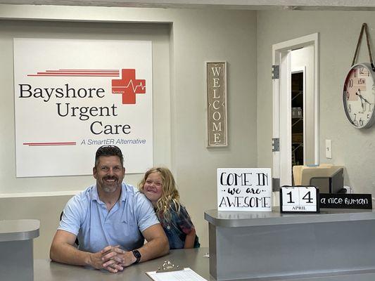 The owner of Ellenton Urgent Care and Bayshore Urgent Care, pictured with his middle child.