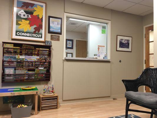 Reception desk with some magazines and toys.