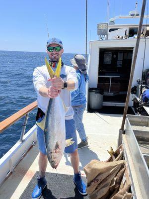 Ryan showing off his one of many yellow tails caught with gear anglers choice set up.