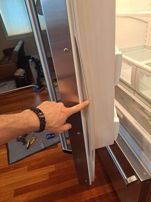 Spotting the problem: Our expert tech identifies a damaged seal, ensuring your fridge runs efficiently. Quality service you can trust!