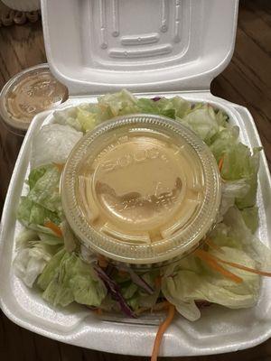 Salad with ginger dressing (comes with meal)