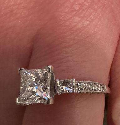 After their "repair"
 The head holding the center diamond is twisted in the setting