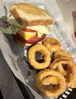 Fully dressed FRIED BOLOGNA SANDWICH with Onion Rings. Delicious!!!