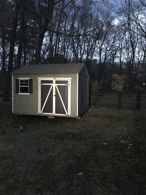 The shed after they moved it and got it into place.  They made it look easy!