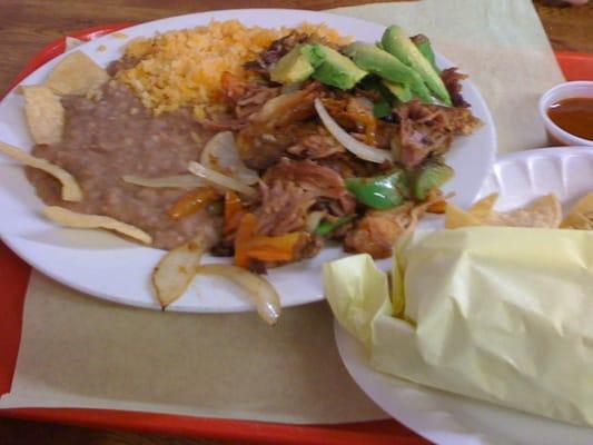 Carnitas plate with side of tortillas and lengua burrito